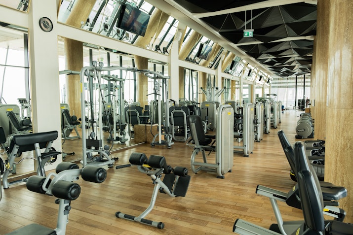 Modern fitness and wellness center featuring state-of-the-art equipment and serene relaxation areas.