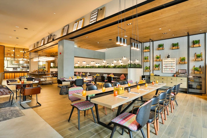 Spacious, well-designed communal workspace with wooden and fabric interiors