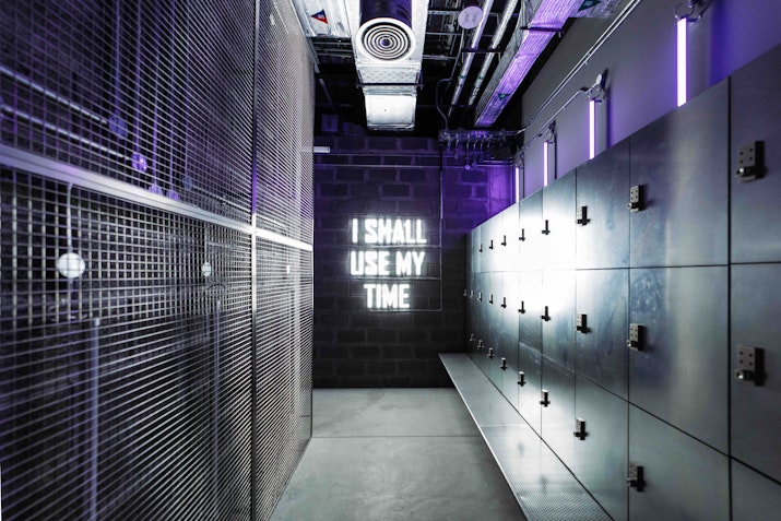 Gym changing rooms with sleek lockers and modern, industrial design