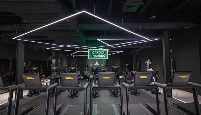 Transform Your Career with Privilee's Corporate Wellness Programme, designed for professional growth and well-being. Transform Your Career with Privilee's Corporate Wellness Programme: modern gym with cardio equipment and sleek design.