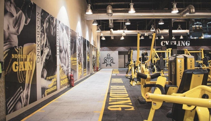 Push your limits at Max Burn Gym. Modern gym space at Max Burn Gym with high-intensity training equipment and weightlifting stations.