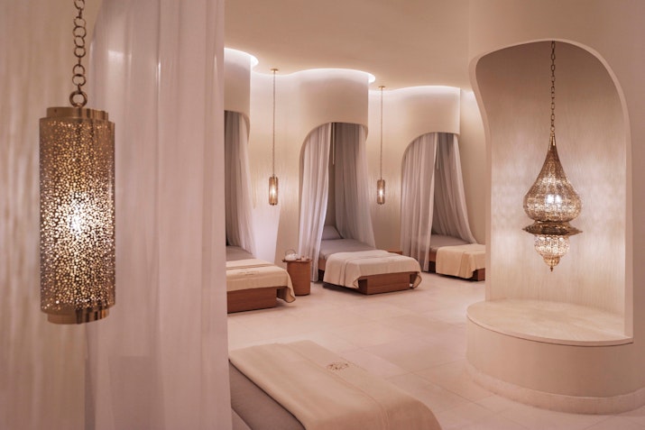 Spa treatment room with decorative lanterns.