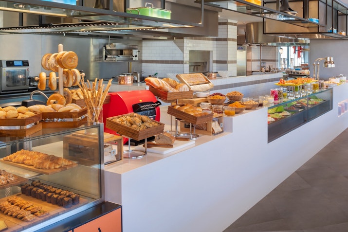 Bakery counter with a variety of pastries and breads on display