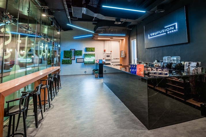 TruFusion Smart Bar Modern wellness lounge with sleek seating, neon accents, and contemporary decor