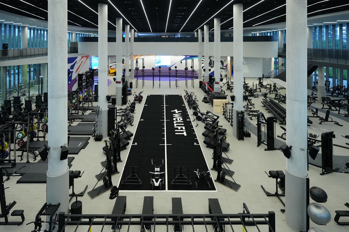 State-of-the-art fitness facilities at Wellfit Madar, featuring modern equipment and spacious workout areas.