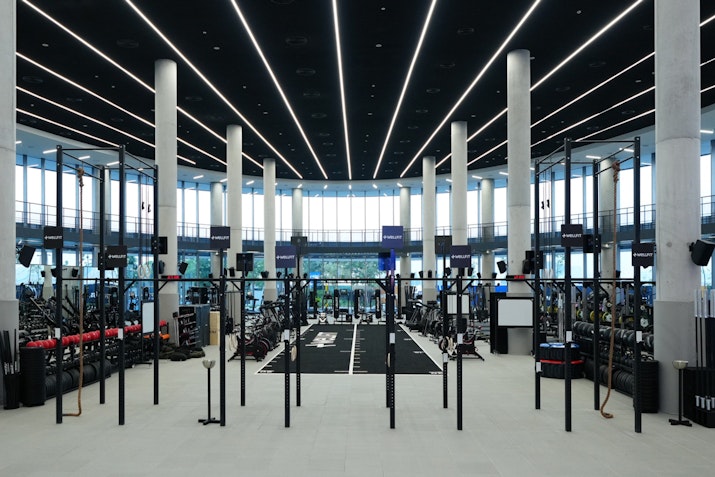 Gym area equipped with functional training tools like kettlebells, rigs, resistance bands, and battle ropes.