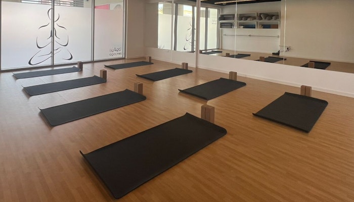 Find balance and peace at Zen Yoga. Serene yoga studio at Zen Yoga, with mats and soft lighting for a calming practice environment.