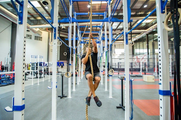 Indoor fitness space at Fly High Fitness, featuring specialized equipment for aerial and strength training.