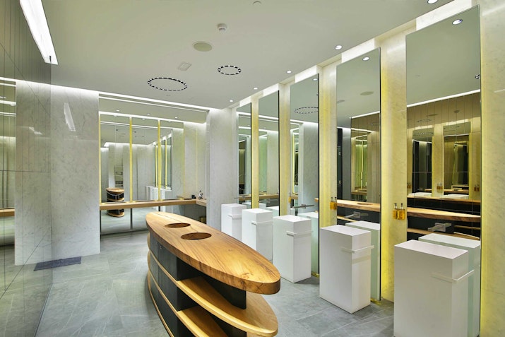Premium changing rooms with lockers, showers, mirrors, and a sleek look and feel.