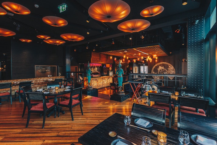 A sophisticated dining setting with warm lighting and stylish decor.