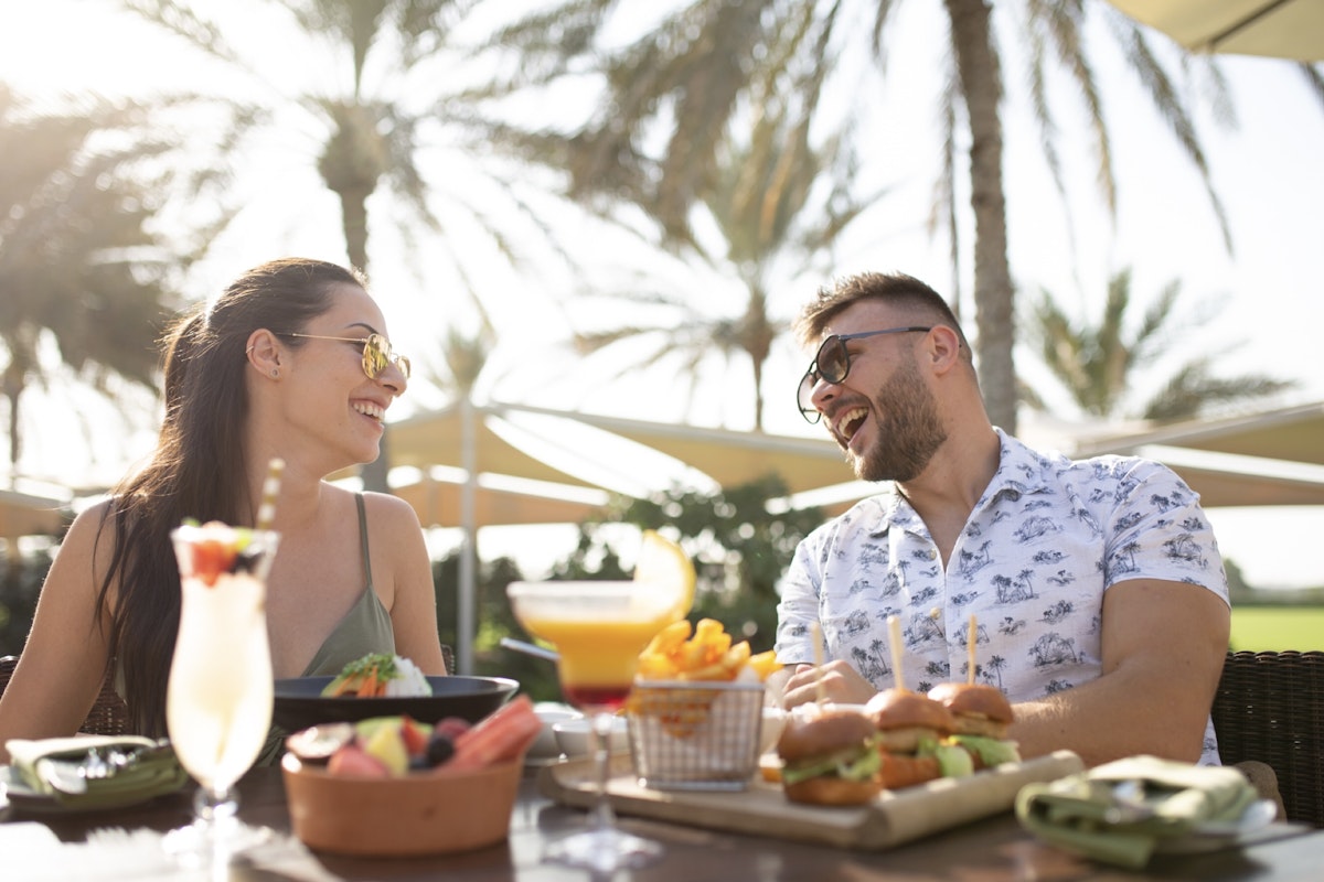 Five romantic dining spots Couple eating under shaded palms