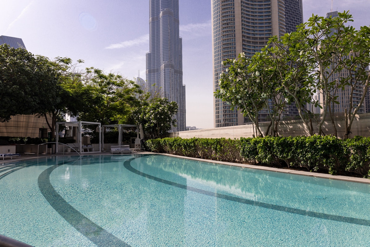 Daycay by the Burj Khalifa Pool with city skyscrapers in the background