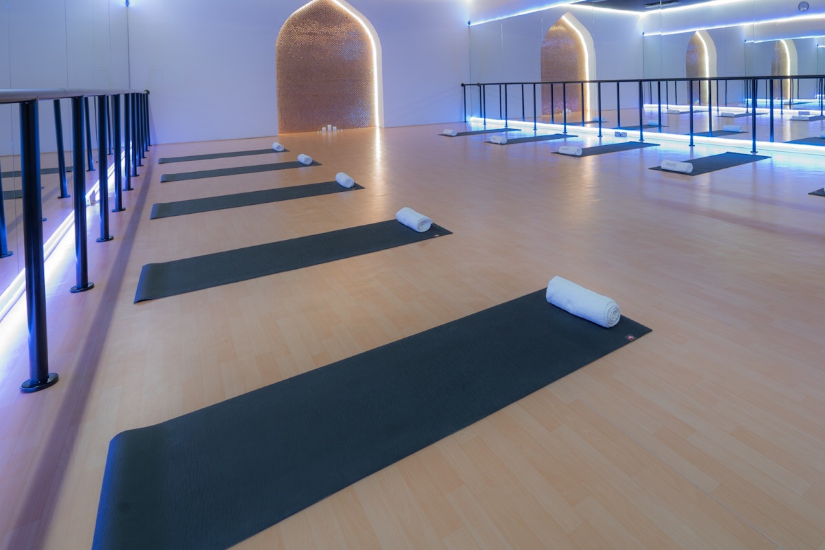 Yoga mats arranged in a serene studio.