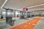Fly High Fitness: well-equipped gym with training zones, weight machines, and a track area