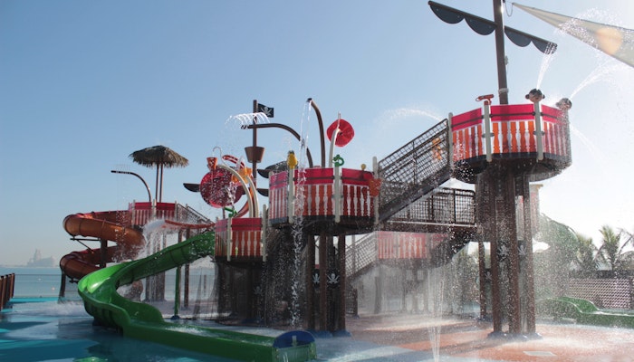 Explore Privilee Resorts in the other Emirates Colorful water playground with slides and water fountains for children.