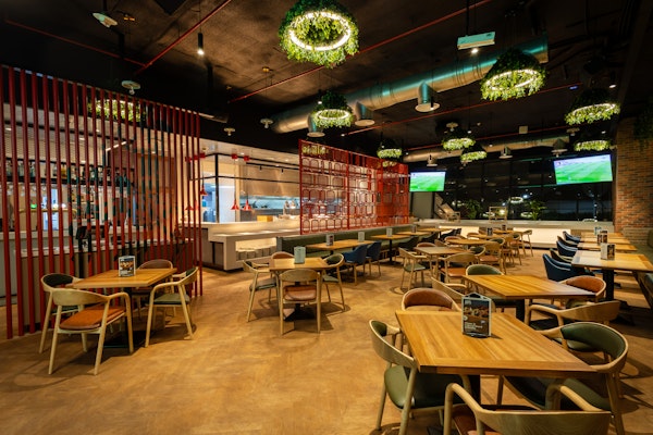 Industrial restaurant with plant based lighting