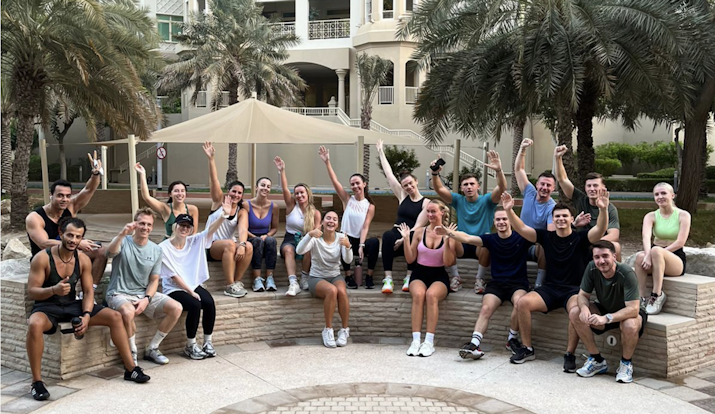 Group of people sitting in fitness clothing