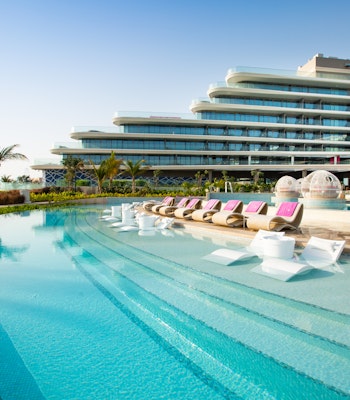 W Palm Wide blue pool with sunken pool loungers