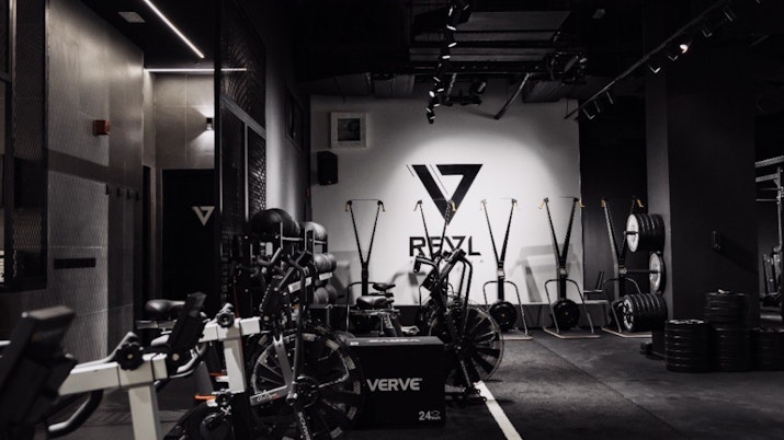 REVL Downtown Open gym area with industrial feel