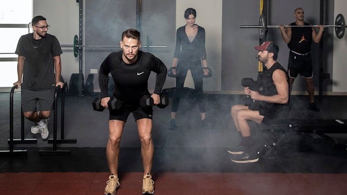 Mix group of men and women doing various exercises