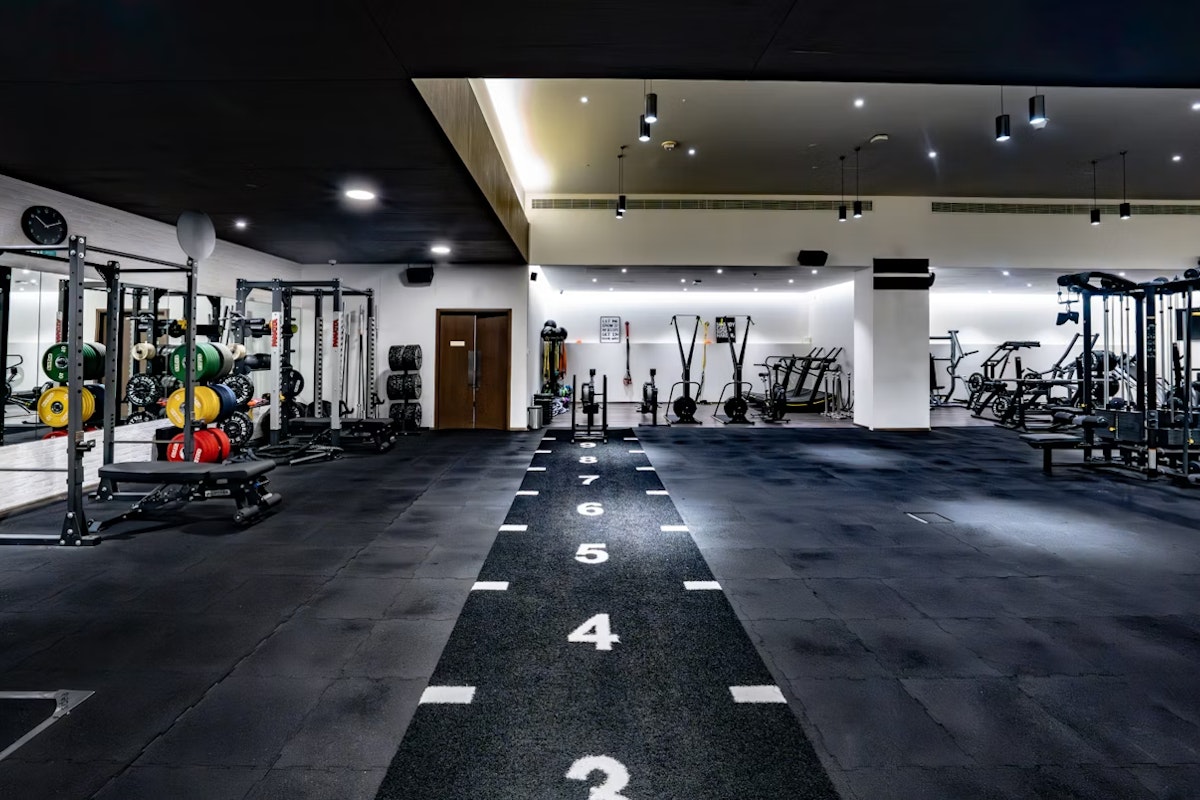 Move at FIVE Open gym space with dark flooring