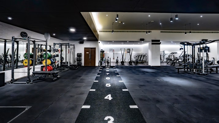 Move at FIVE Open gym space with dark flooring