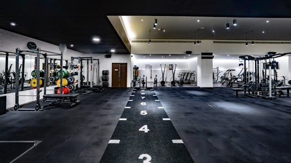 Open gym space with dark flooring