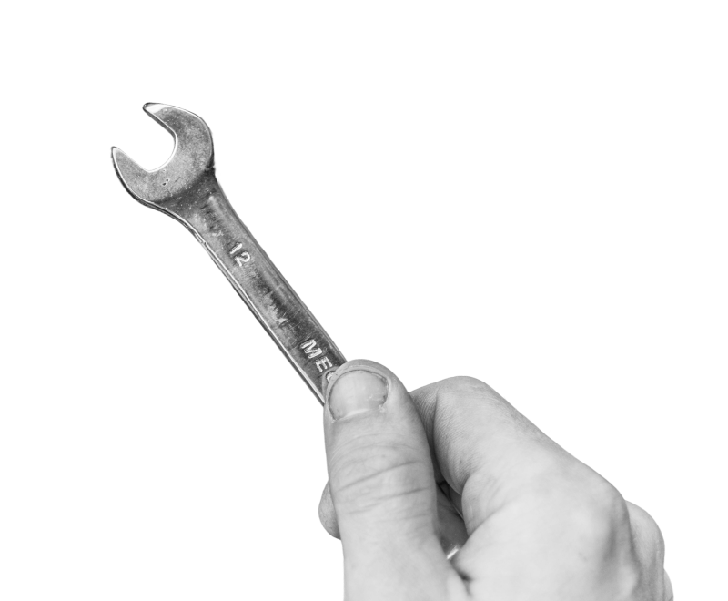 Hand holding a wrench