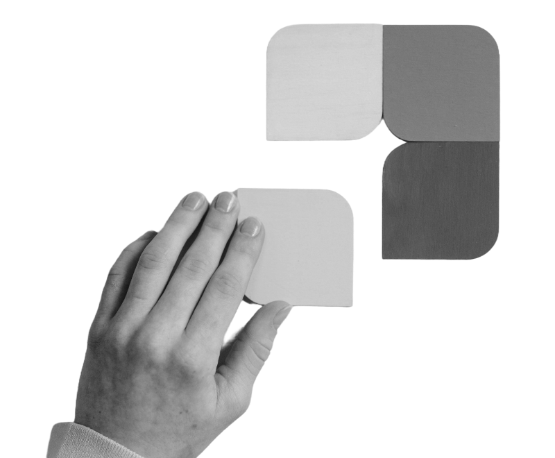 hand laying puzzle piece