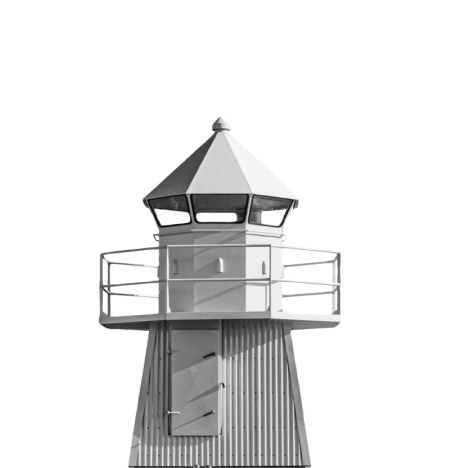 Black and white image of a lighthouse with a conical roof and large windows. A railing encircles the top, above a door with a small stairway leading up. The structure appears isolated against a blank background.