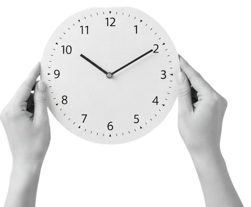 Two hands holding a round wall clock showing the time as 10:10. The clock has a white face with black numbers and tick marks, and the image is in black and white.