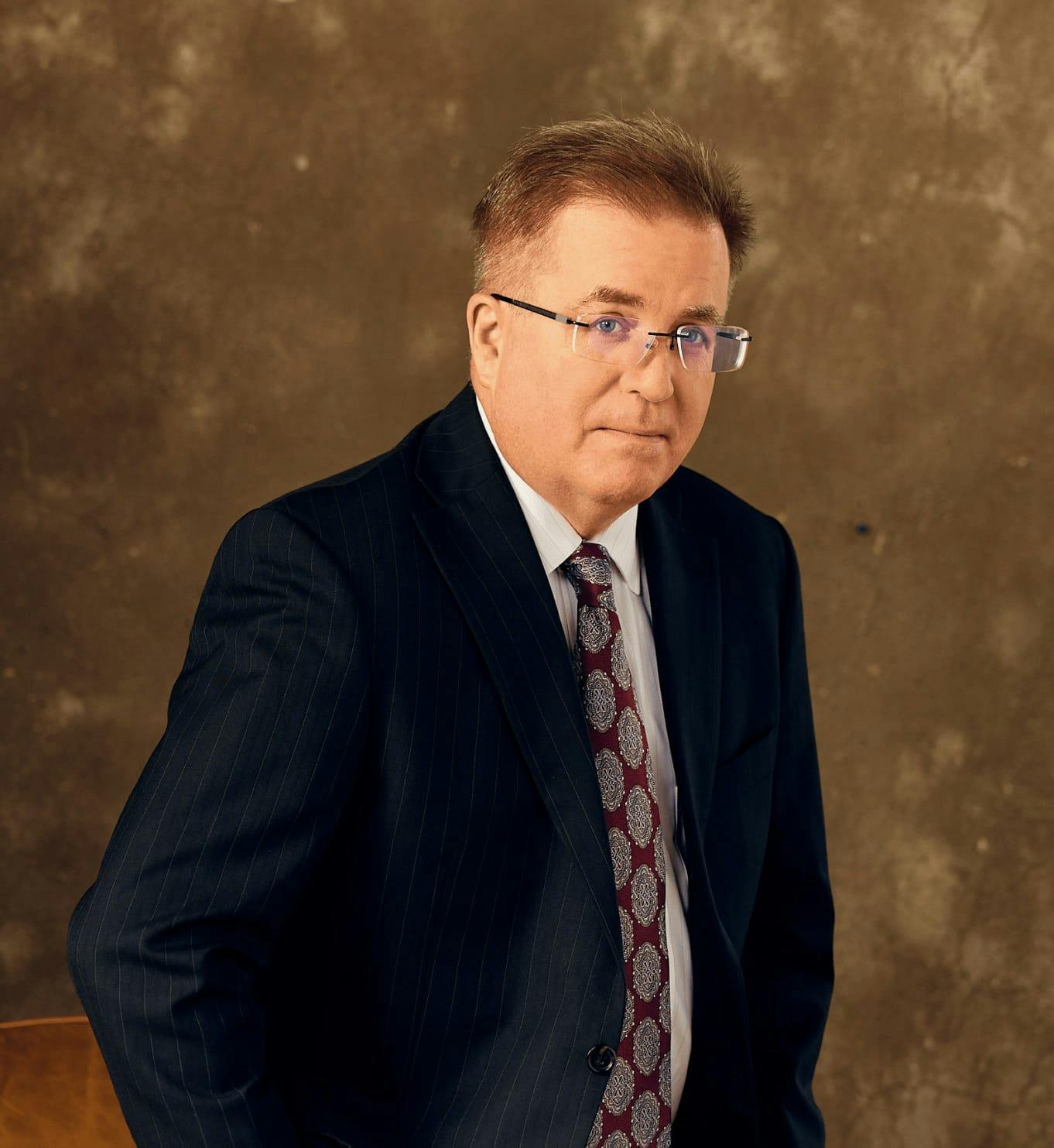 Man in a suit and glasses