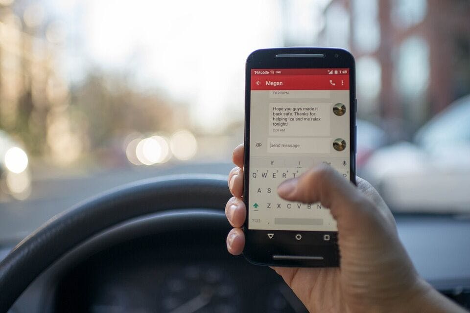 Person texting and driving