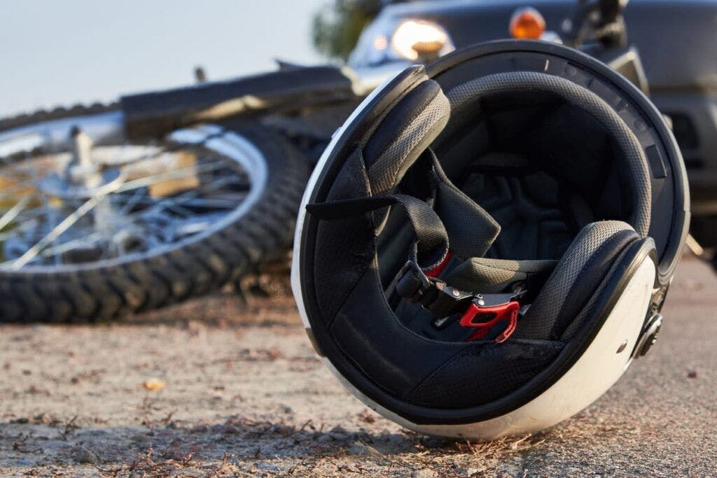 Helmet next to motorcycle crash