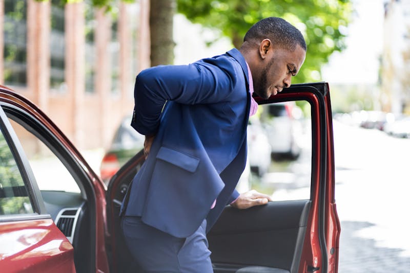 man with injured back after a car accident