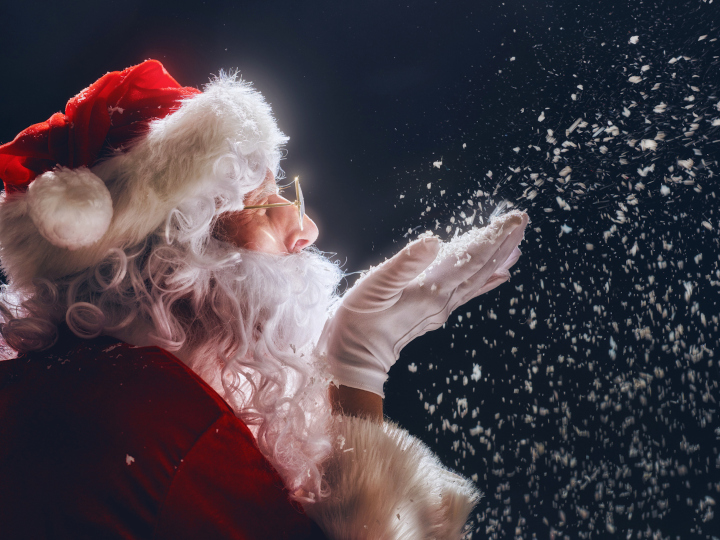 Jultomten Jultomten blåser snö från sin hand