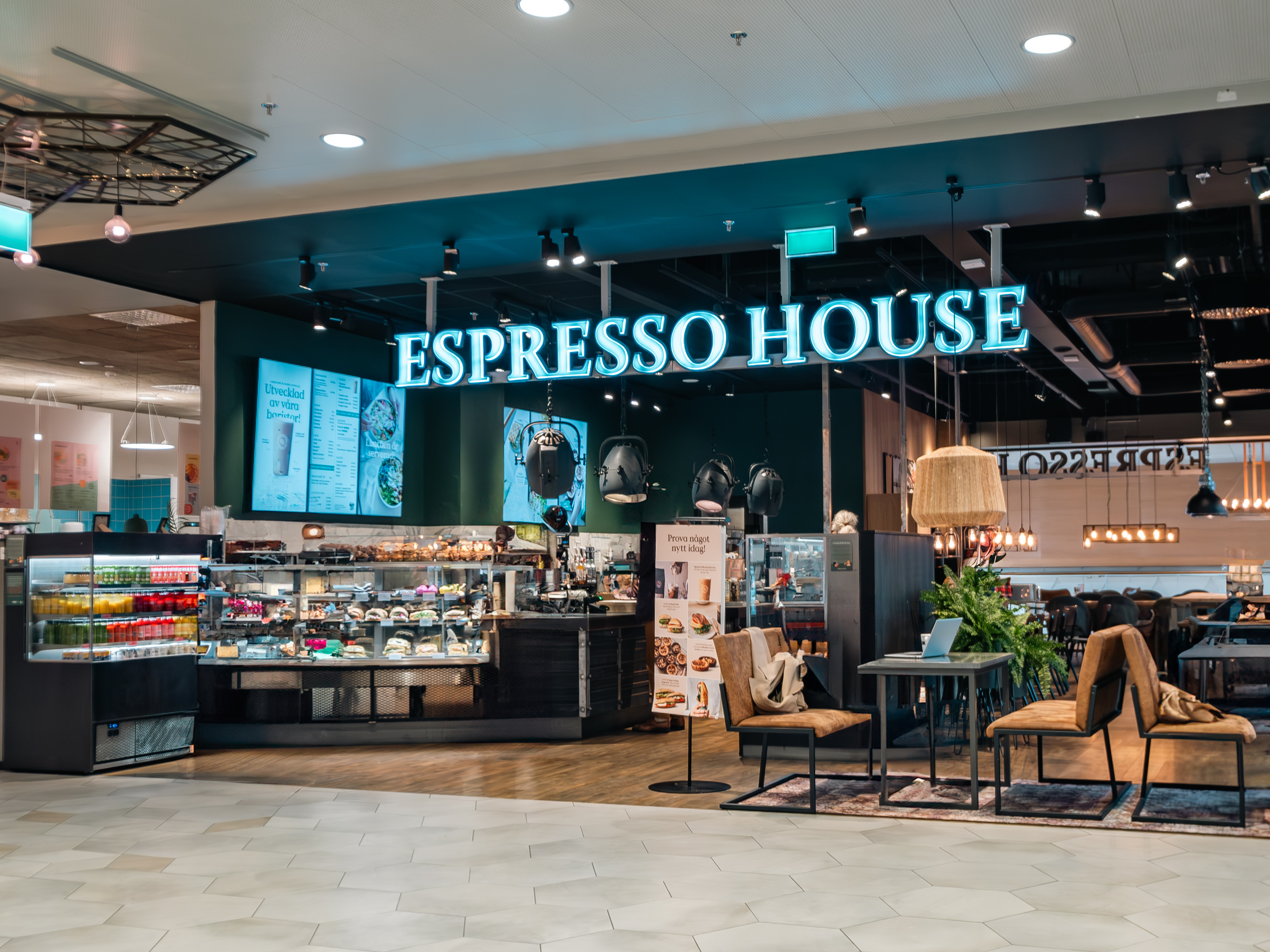 Logotyp Espresso House Femman övre plan