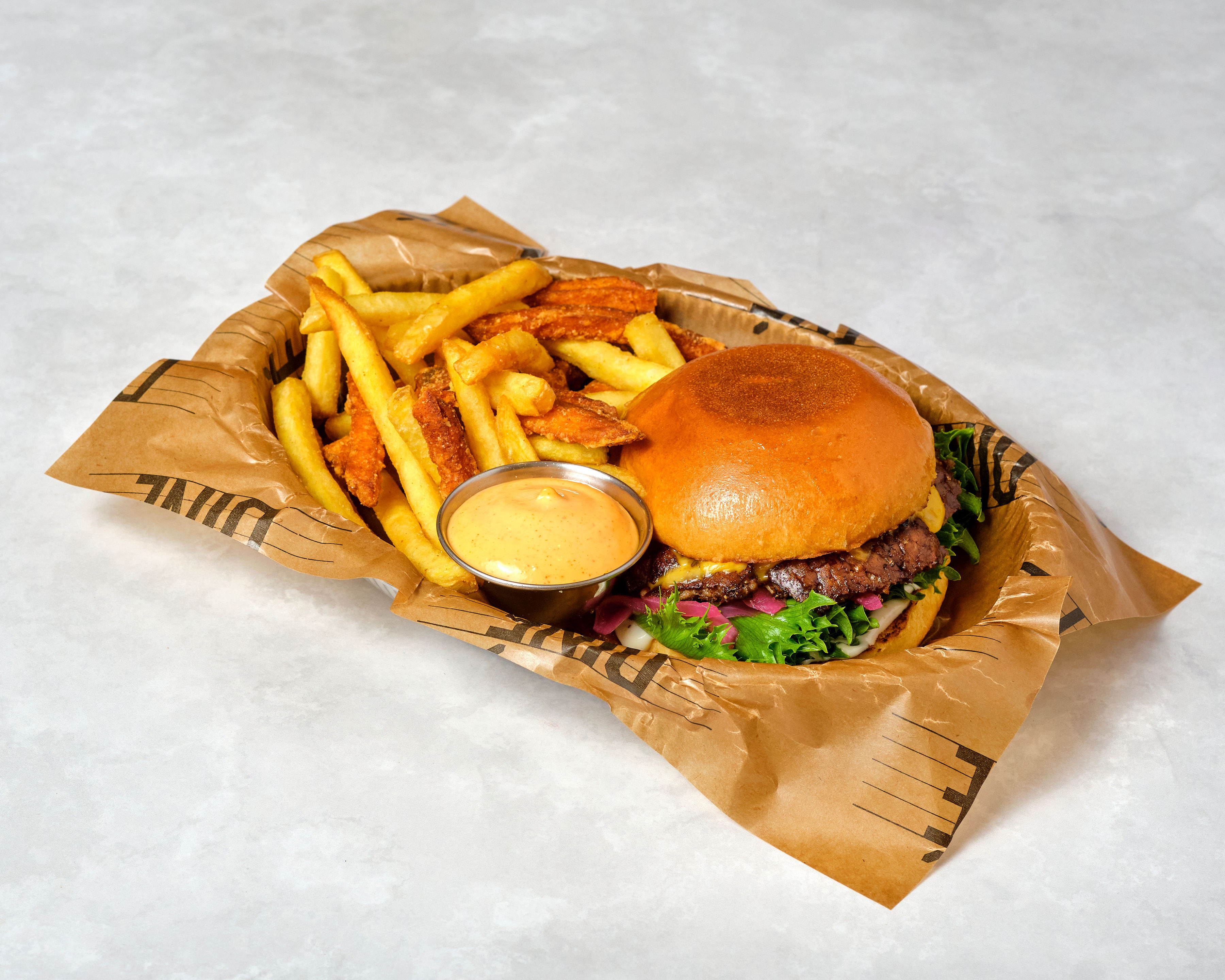 Hamburger with fries and dip sauce