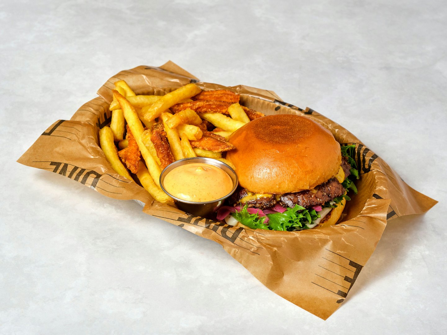 Hamburger with fries and dip sauce