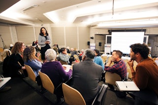 Conference participants discussing the conference's themes.