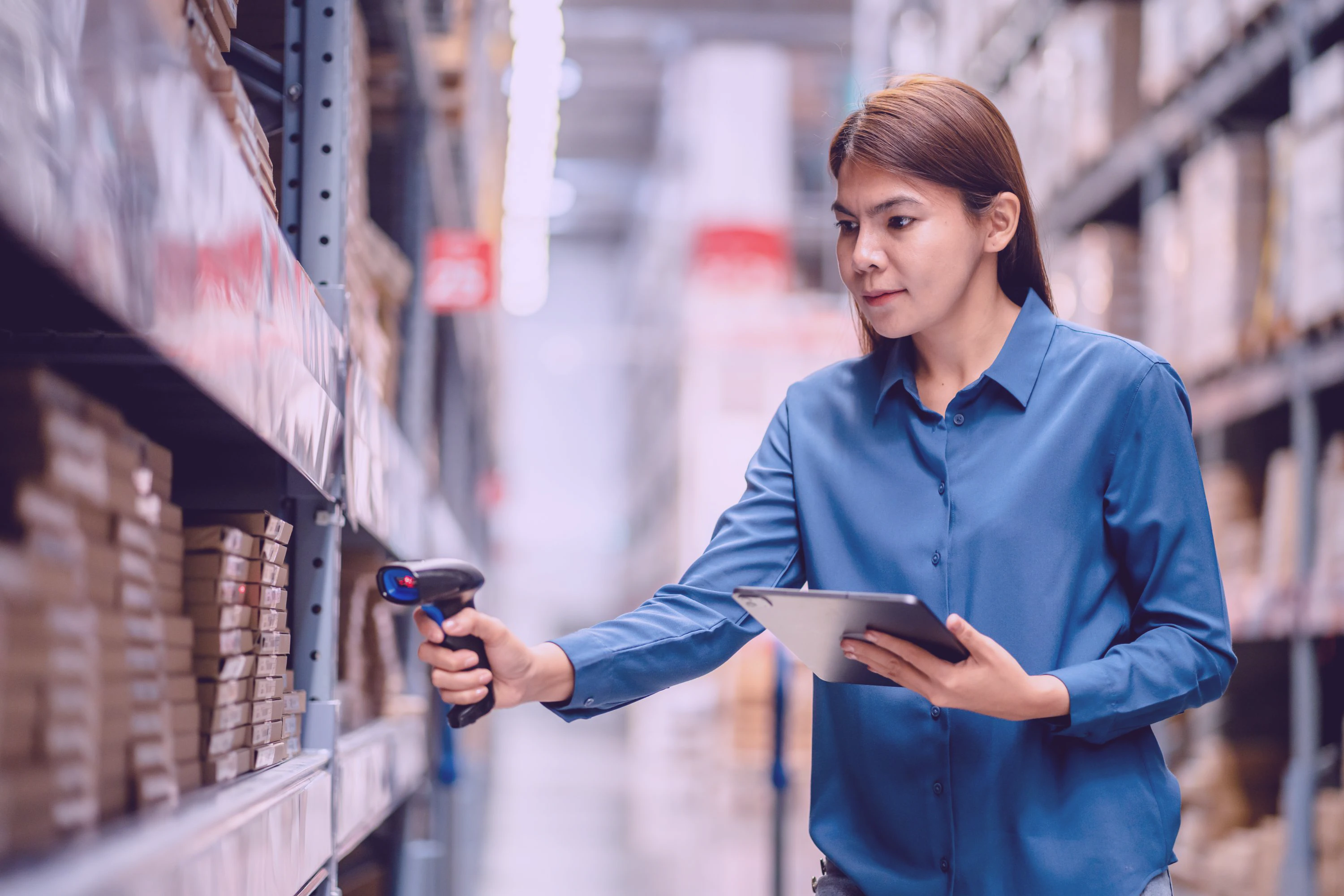 woman scanning inventory with barcode reader