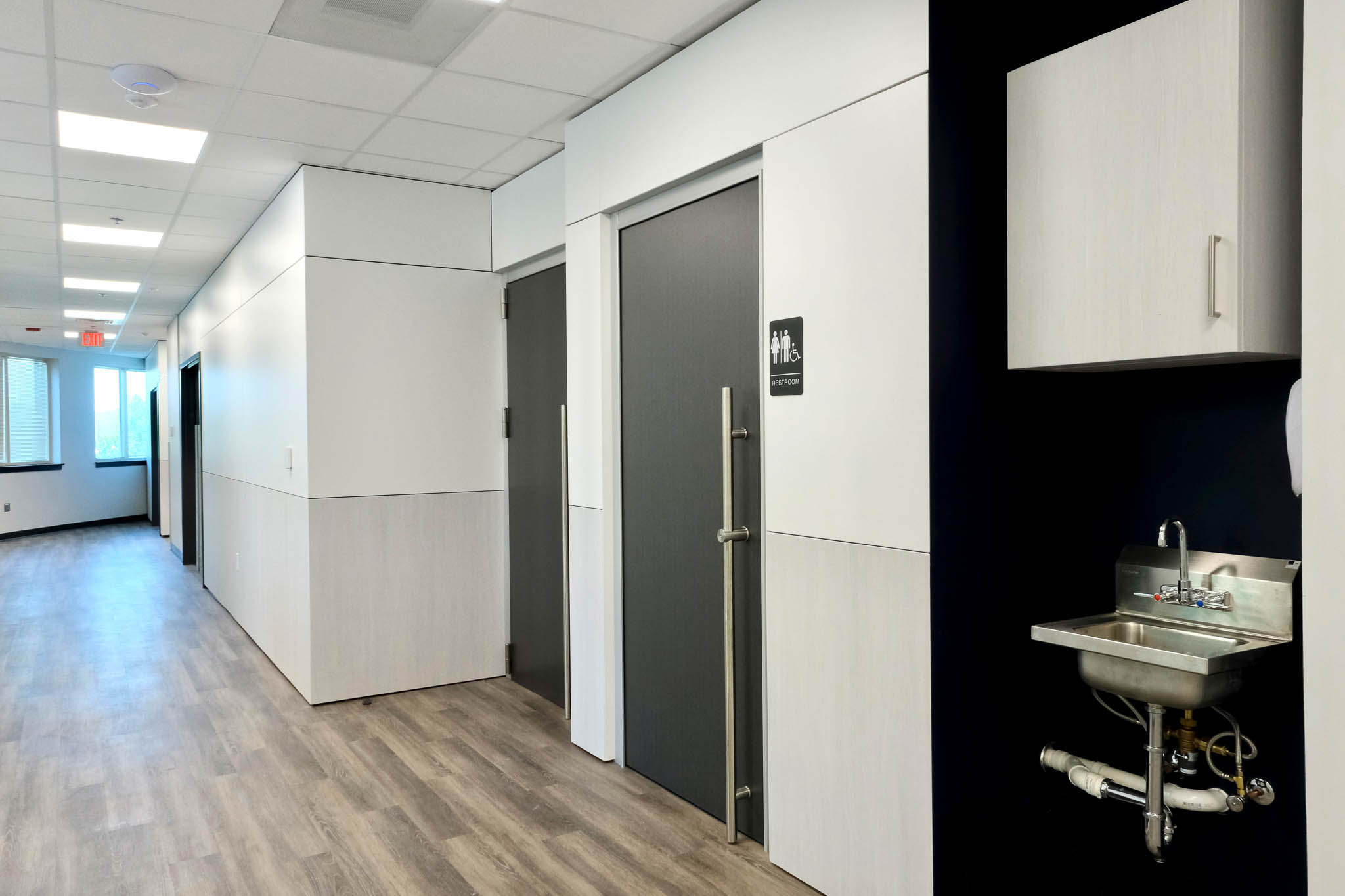 Interior view showcasing Falkbuilt's solid wall construction in a medical construction setting with solid cladding, doors, and sink and accessoriessolid walls, healthcare construction, prefabricated construction