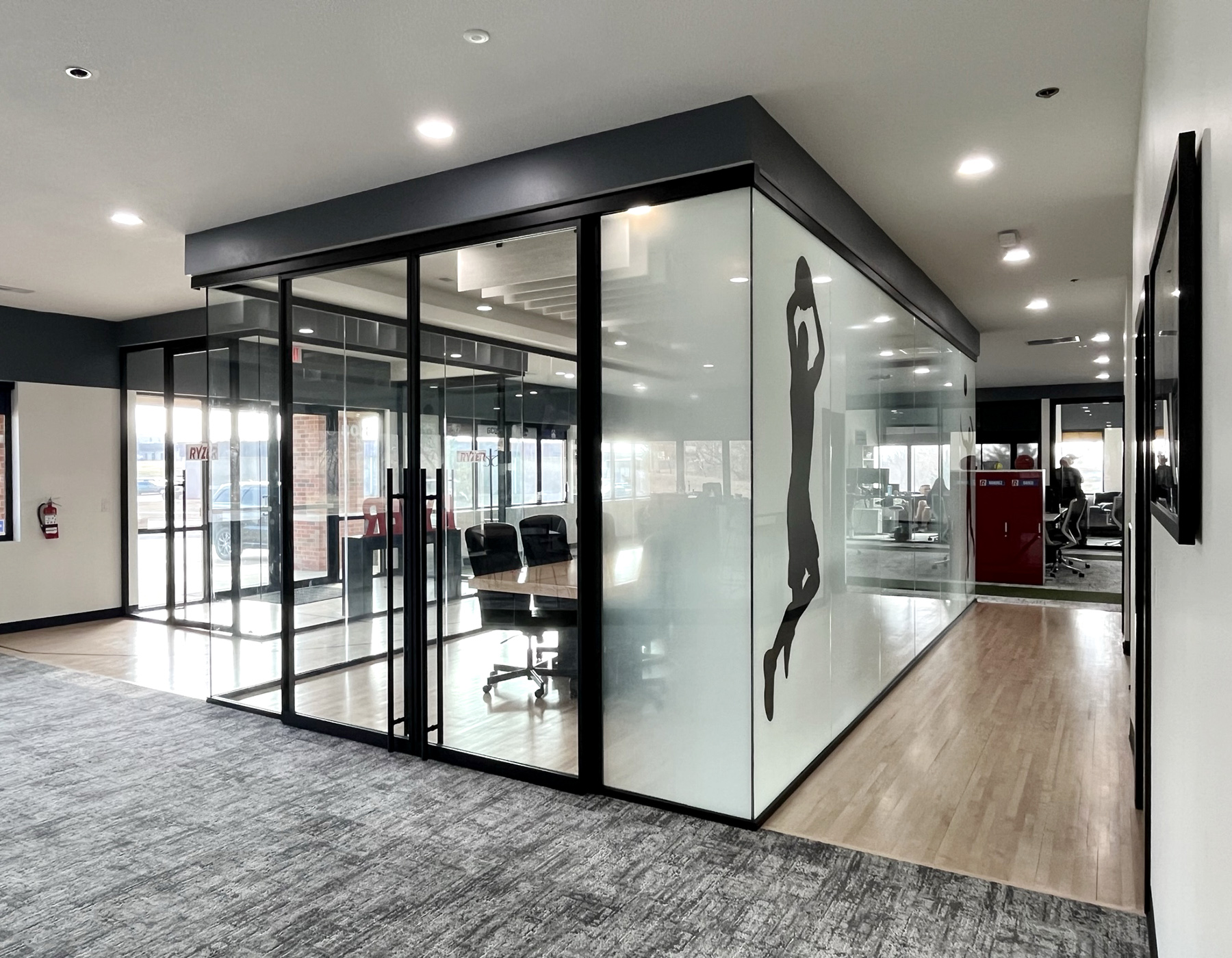 Interior view showcasing Falkbuilt's glass wall construction in a corporate setting.
