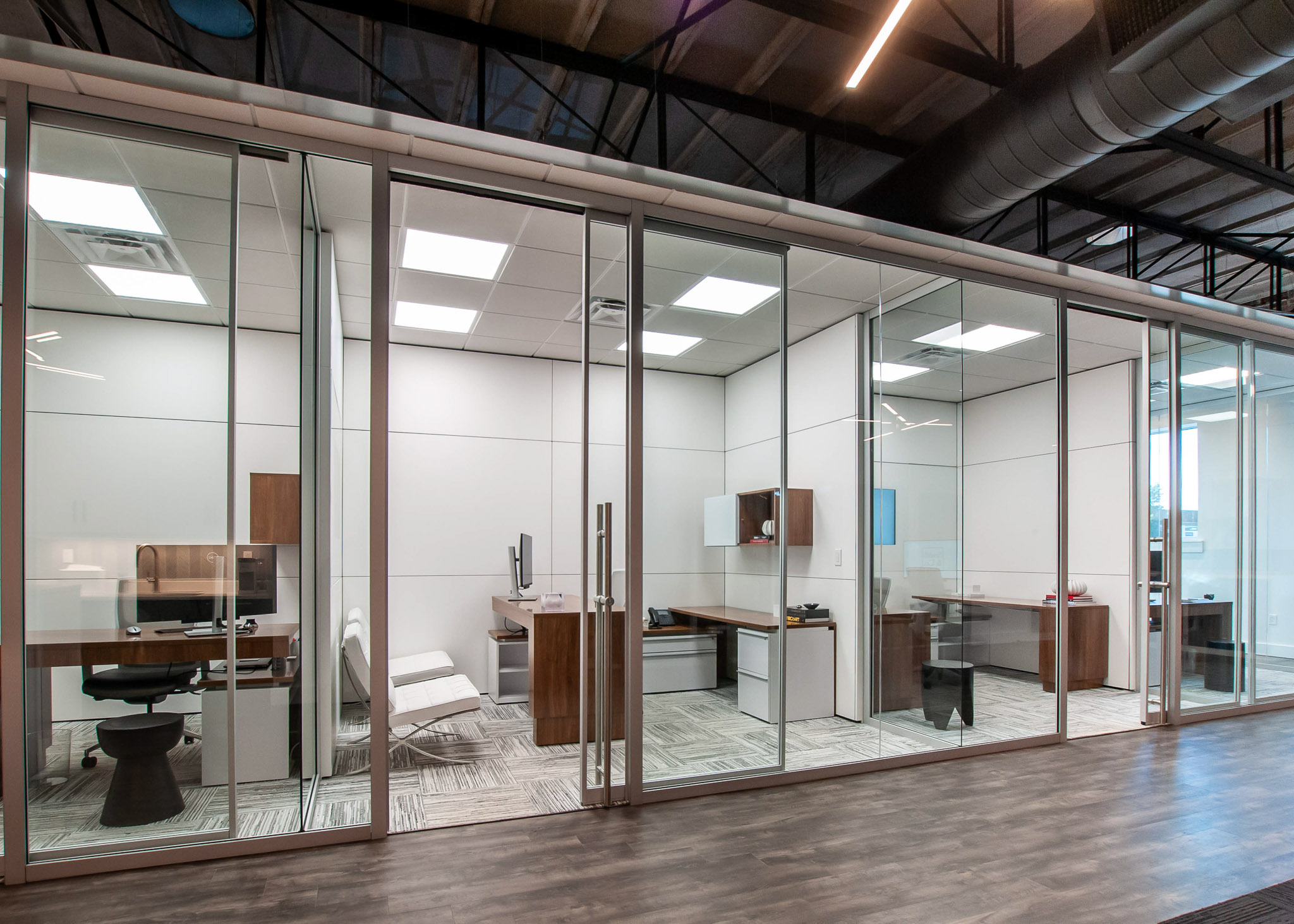 Interior view showcasing Falkbuilt's glass walls in a corporate setting.