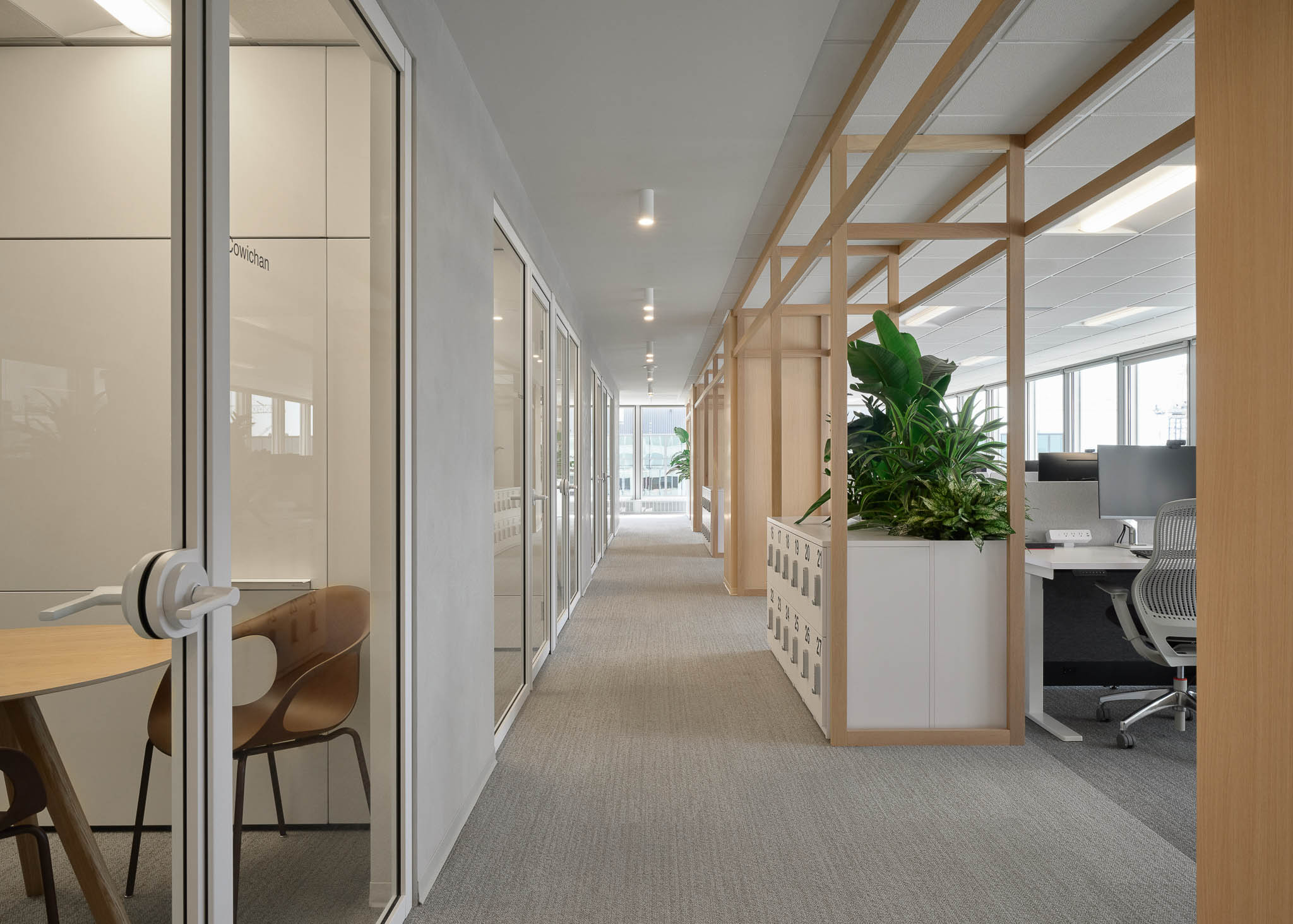 Interior view showcasing Falkbuilt's glass wall construction in a corporate setting.