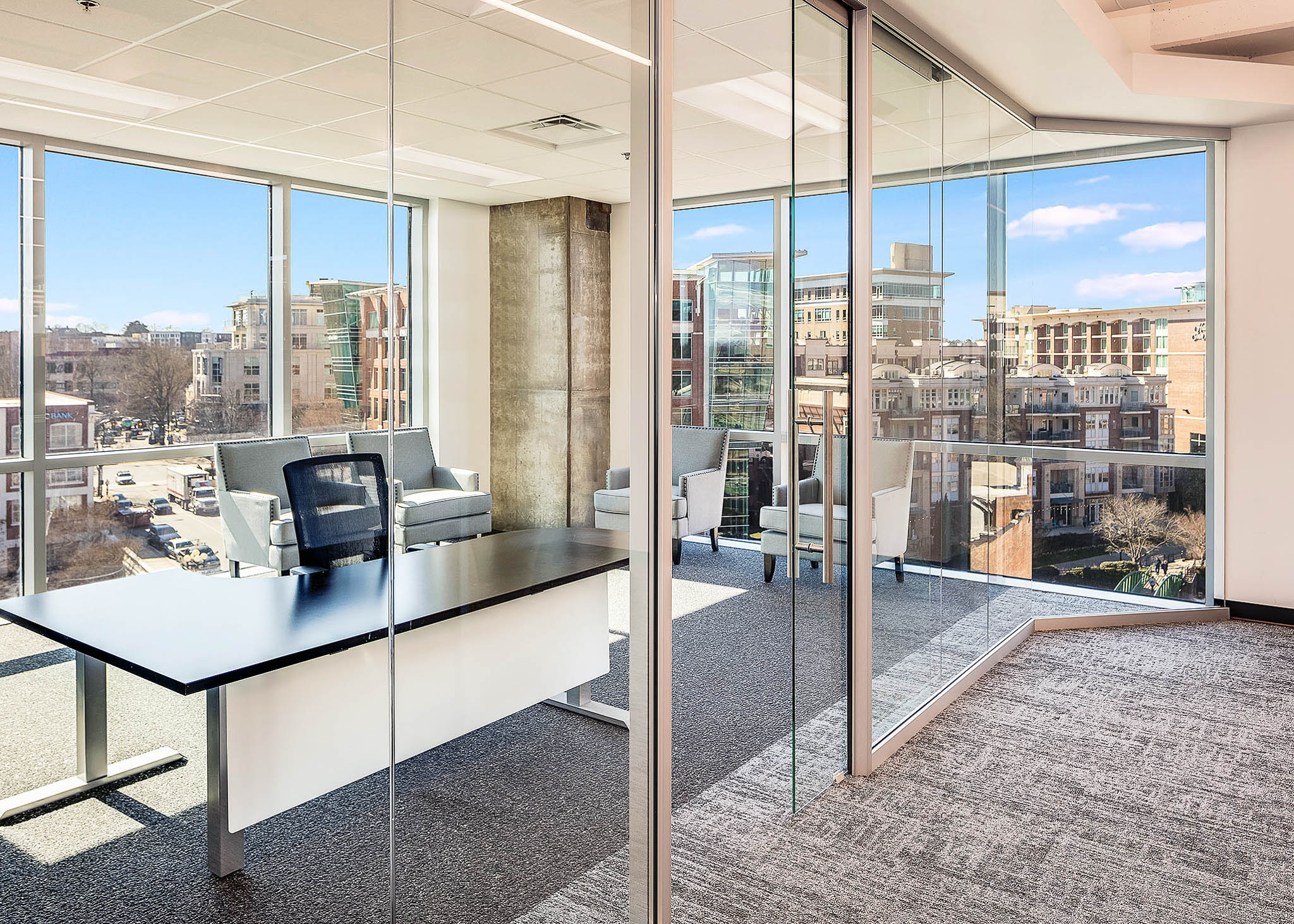 Interior view showcasing Falkbuilt's glass wall construction in a corporate setting.