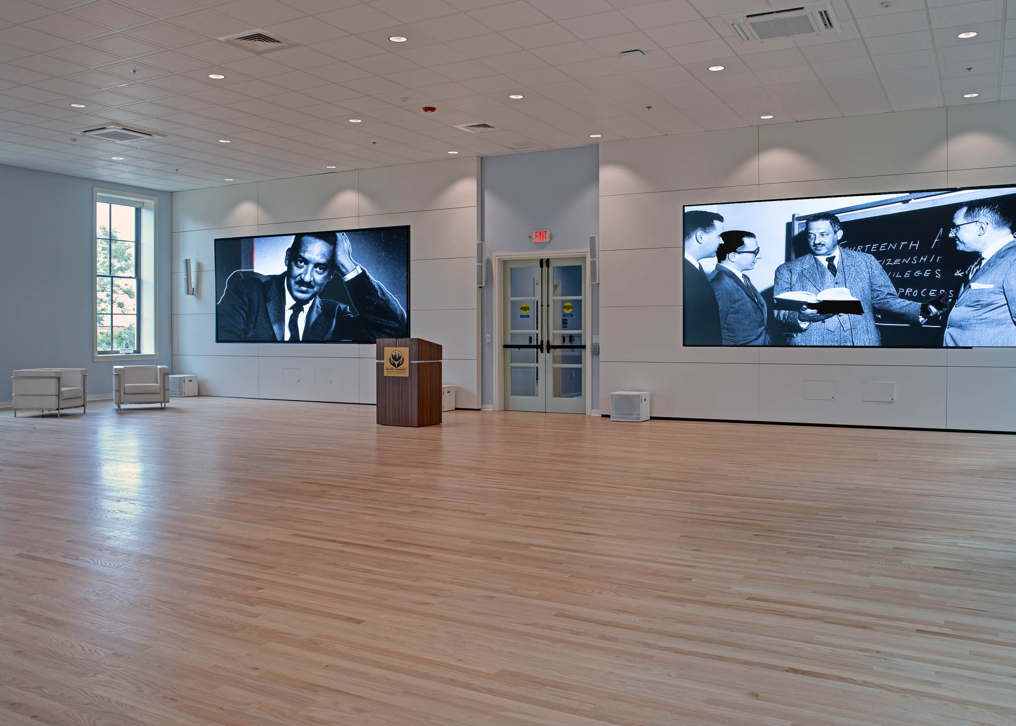 Interior view showcasing Falkbuilt's solid wall construction in an educational setting with a furred curtain wall and integrated technology