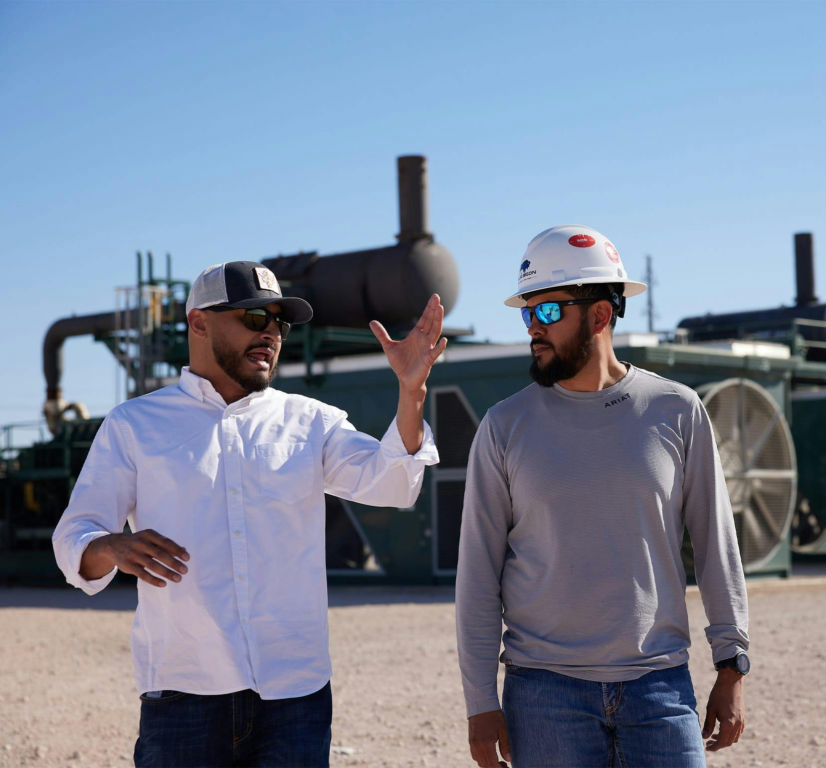 2 men talking to eachother on construction site