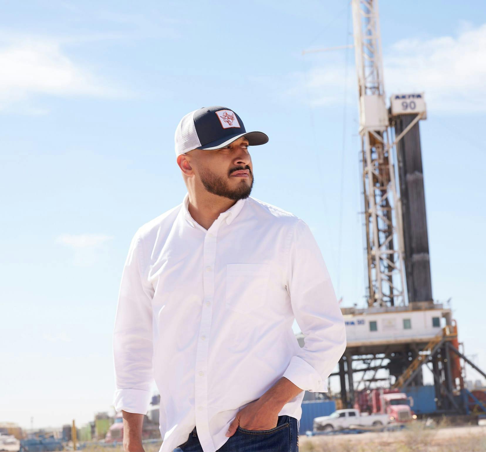 man standing in front of oilfield machine