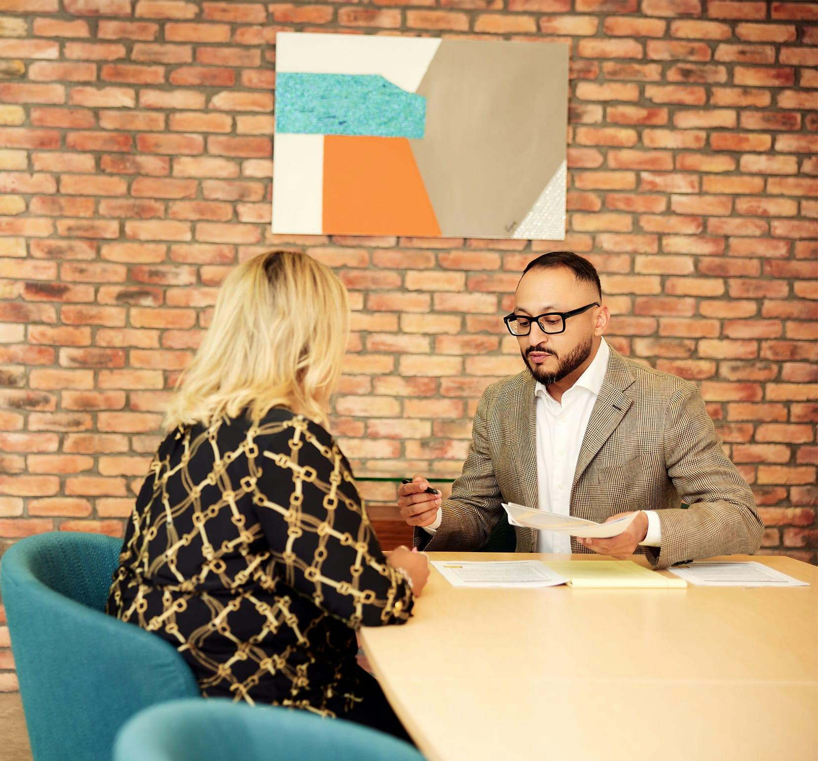 attorney and client at table discussing